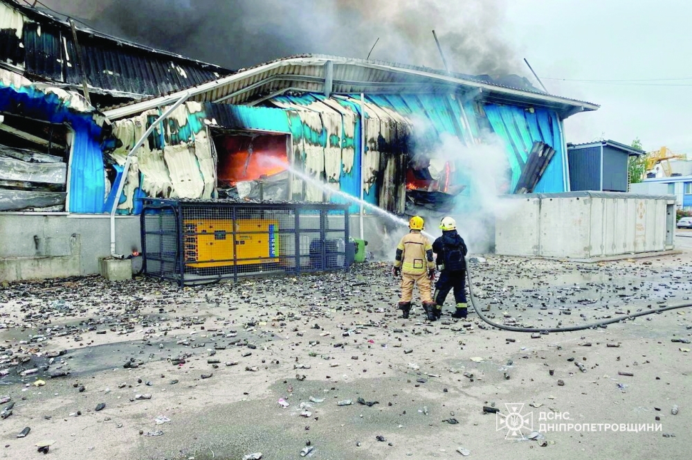 Rescuers work at a site of apartment buildings hit by a Russian drone strike in Dnipro, Ukraine. — Reuters 