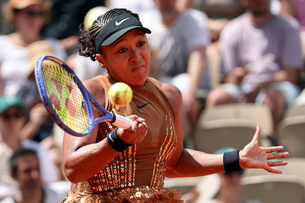 Japan's Naomi Osaka plays a forehand return to US Iva Jovic 