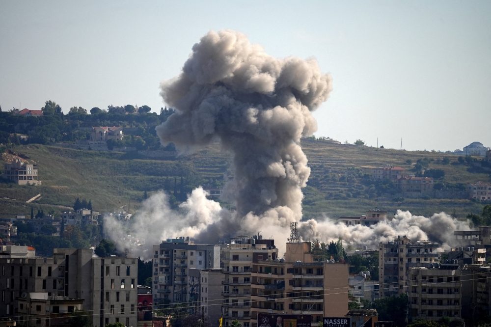 Smoke billows from southern Lebanon, following Israeli strikes, as seen from Nabatieh, Lebanon, May 31, 2026.