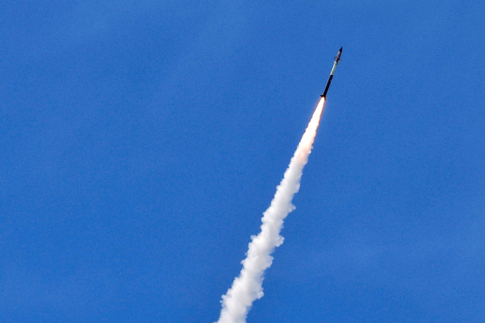 This picture taken from a position in the Upper Galilee region in northern Israel shows an Israeli Iron Dome missile streaking accross the sky to intercept incoming projectiles on May 31, 2026.