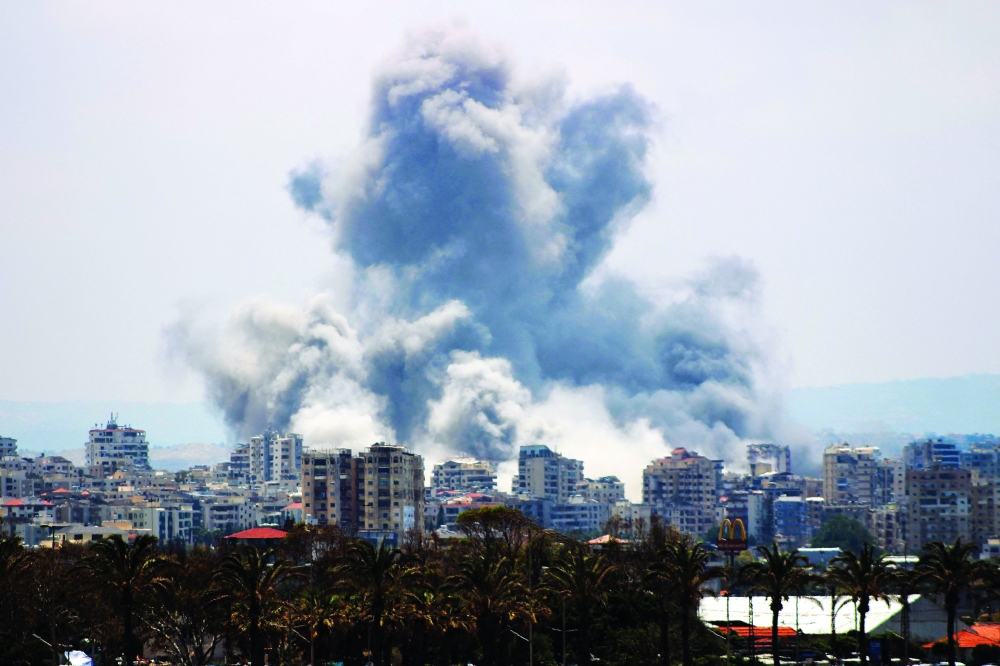 A plume of smoke rises following an Israeli air strike on the outskirts of Tyre, southern Lebanon. — AFP