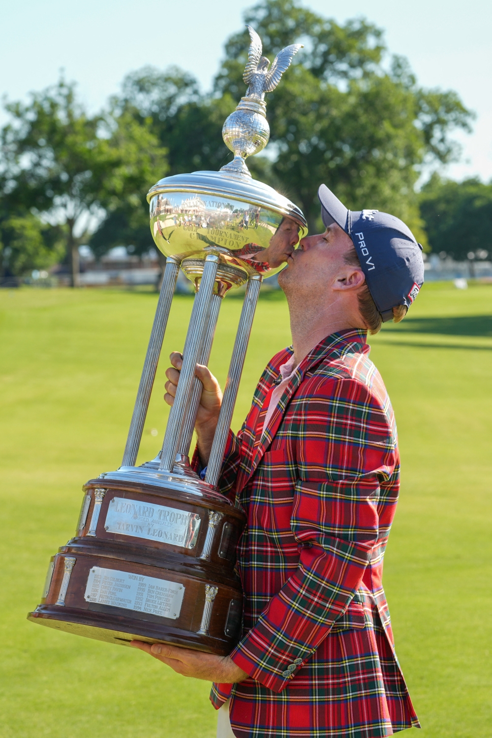  Russell Henley kisses the winners trophy following the final round of the Charles Schwab Challenge golf tournament