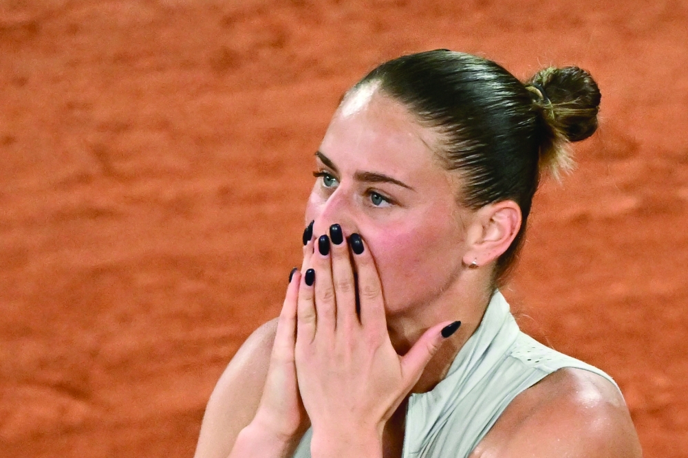 Ukraine's Marta Kostyuk reacts to her victory over Ukraine's Elina Svitolina at the end of their women's quarter final singles match on day 10 of the French Open tennis tournament on Court Philippe-Chatrier at the Roland-Garros Complex in Paris on June 2, 2026. (Photo by JULIEN DE ROSA / AFP)
