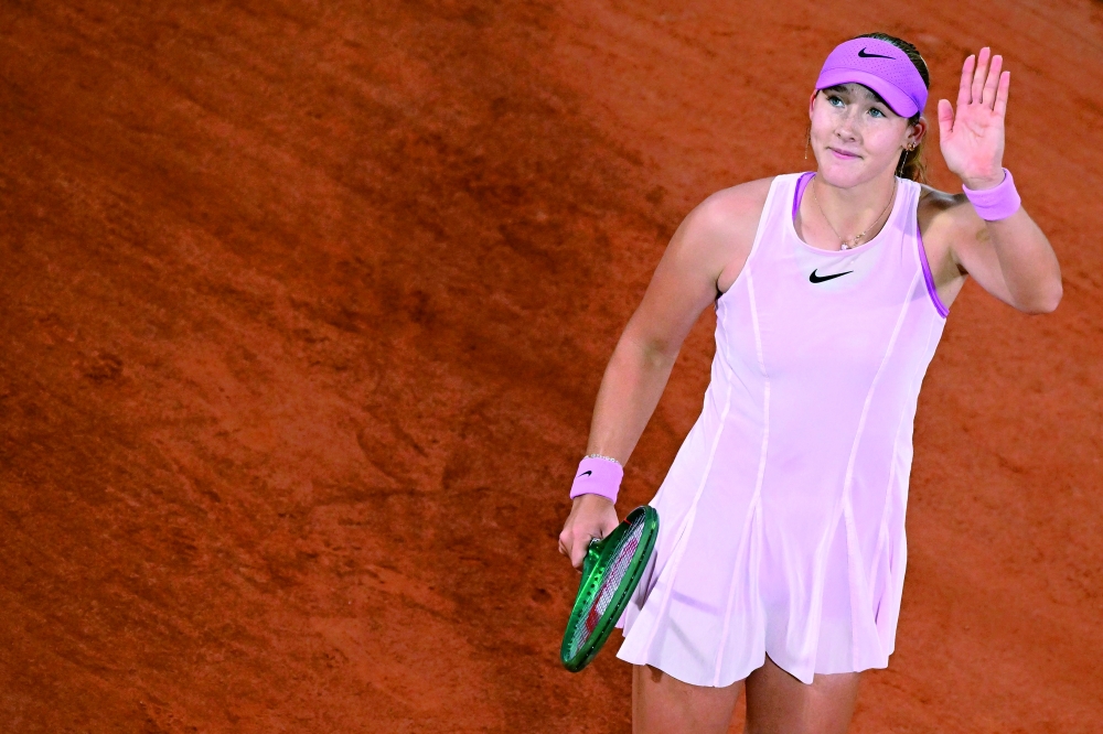 Mirra Andreeva celebrates her victory at the end of her women's quarter final singles match against Romania's Sorana Cirstea on day 10 of the French Open tennis tournament on Court Philippe-Chatrier at the Roland-Garros Complex in Paris on June 2, 2026. (Photo by JULIEN DE ROSA / AFP)
