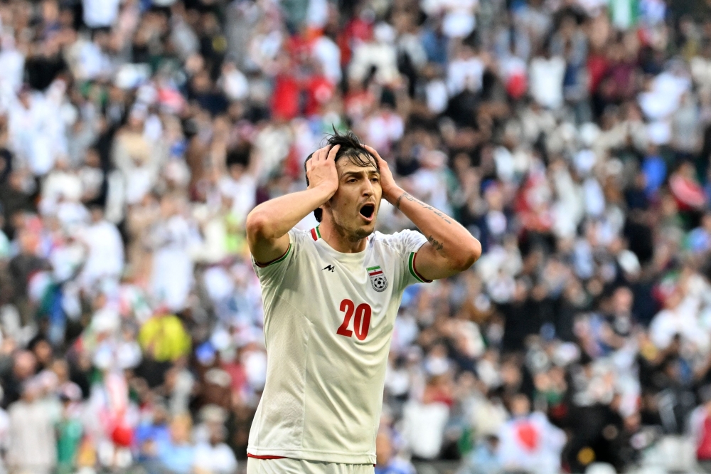 Iranian striker Sardar Azmoun, the third-highest scorer in the history of the Iranian national team, is not among the players selected for the World Cup. — AFP