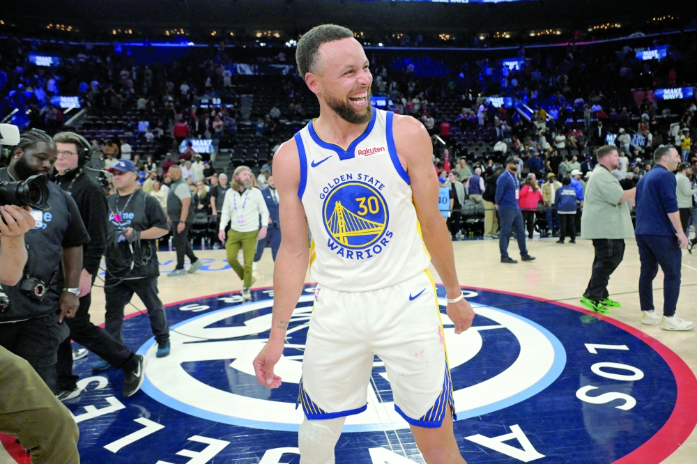 Golden State Warriors guard Stephen Curry (30) smiles on the court after defeating the Los Angeles Clippers during the play-in rounds of the 2026 NBA Playoffs at Intuit Dome. — Imagn Images