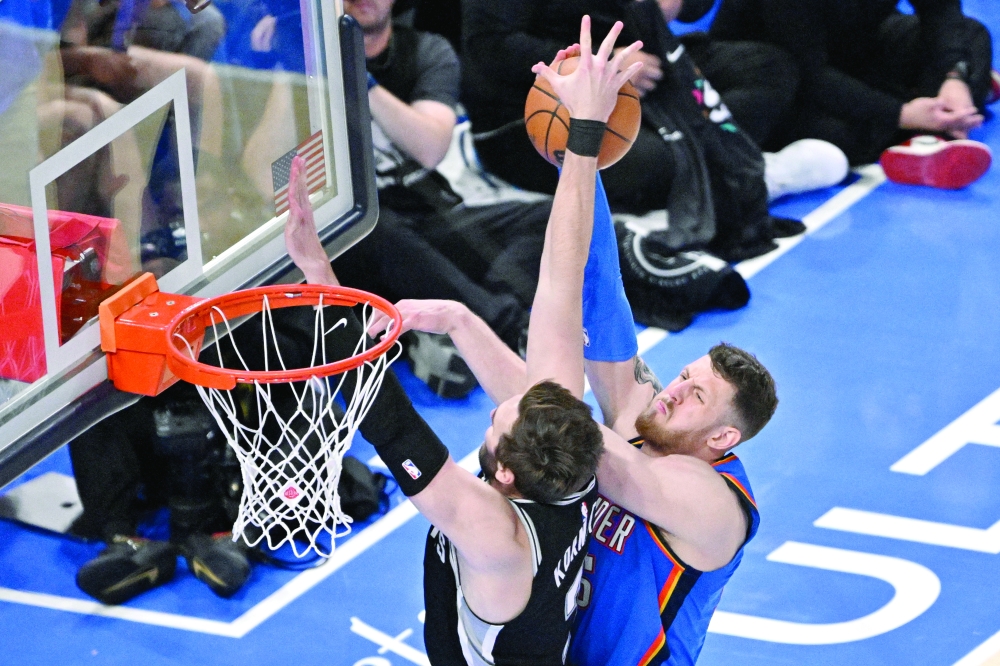 San Antonio Spurs' Luke Kornet (7) blocks Oklahoma City Thunder's Isaiah Hartenstein (55) during game seven of the western conference finals for the 2026 NBA playoffs at Paycom Center. — Imagn Images
