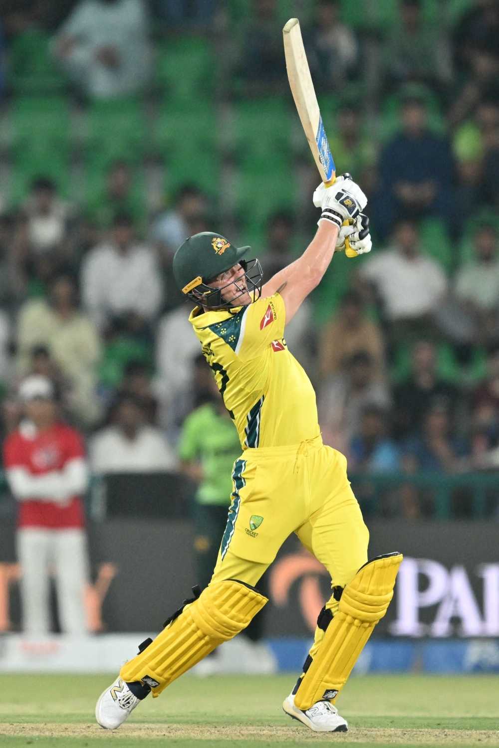 Australia's Nathan Ellis plays a shot during the second one-day international (ODI) cricket match between Australia and Pakistan  
