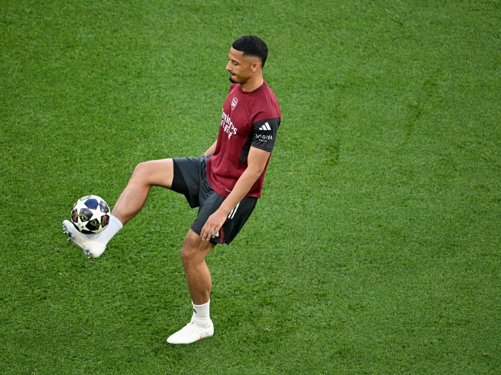 Arsenal's French defender William Saliba plays the ball during training session  