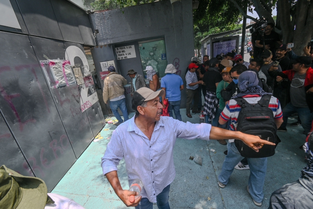 Protesters break into the Ministry of Education during a demonstration by the National Coordination of Education Workers (CNTE) in Mexico  