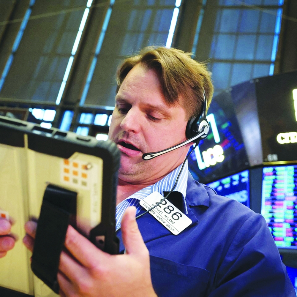 Traders work on the floor at the New York Stock Exchange (NYSE) in New York City, U.S. REUTERS