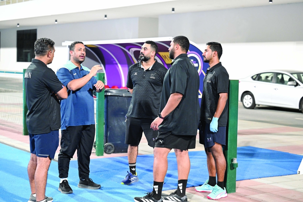 Oman coaching staff during a discussion. — Khalfan al Ruzaiqi