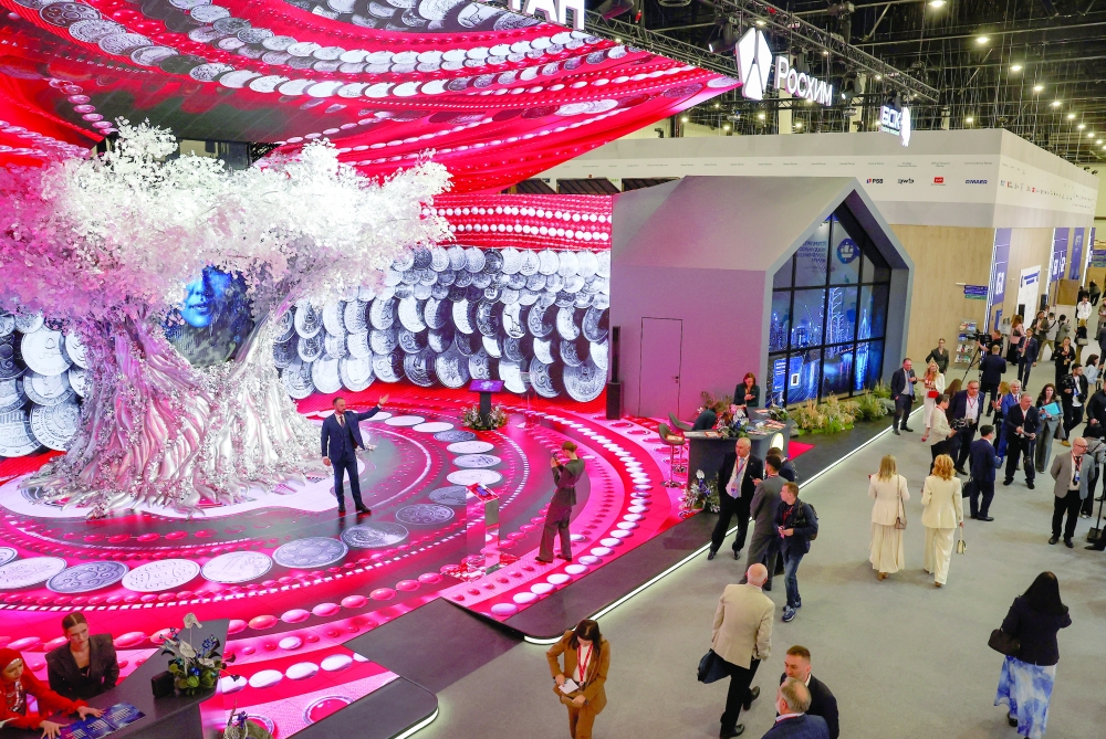 Participants walk at the venue of SPIEF in Saint Petersburg, Russia. - Reuters