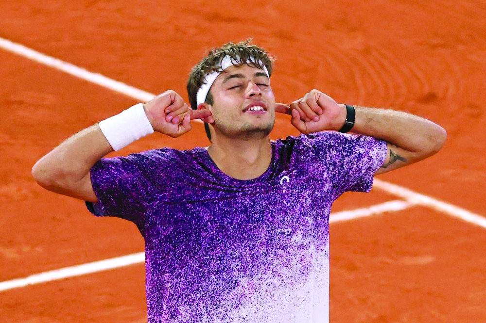 Italy's Flavio Cobolli celebrates his victory at the end of his men's quarter final singles match against Canada's Felix Auger-Aliassime 