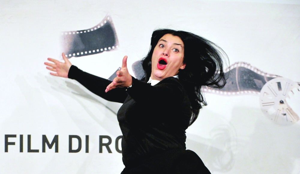 Iranian writer and film director Marjane Satrapi gestures as she poses during the photocall of the latest film 'La bande des Jotas' (Gang of the Jotas) in Rome