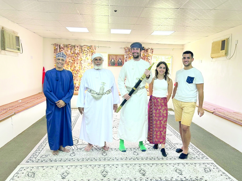 The tourists seen with an Omani family in Nizwa