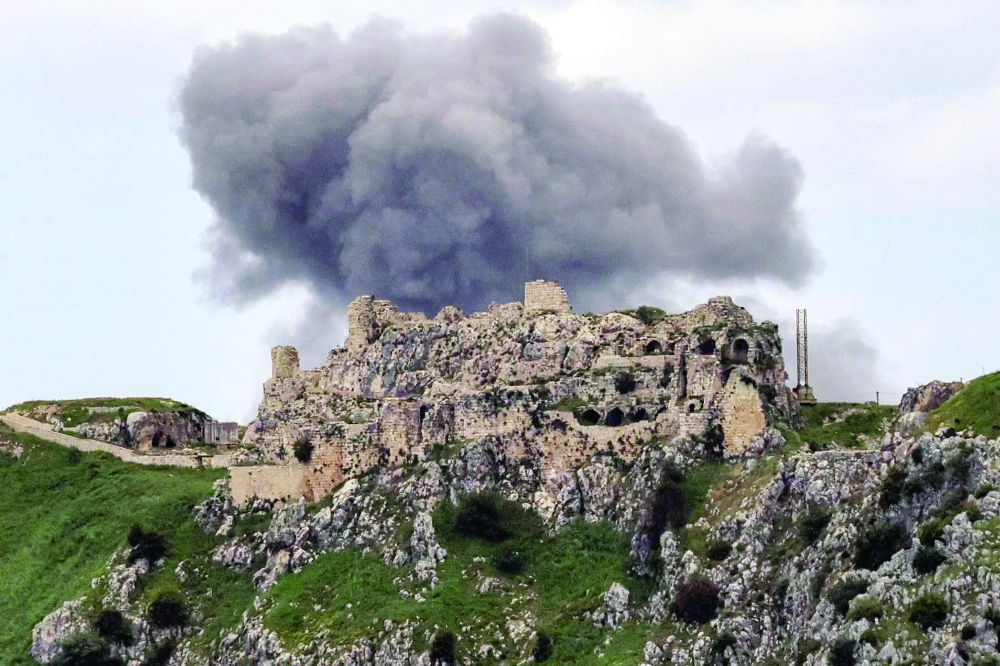 Smoke rises from Israeli bombardment on the village of Yohmor in southern Lebanon behind the 12th century Crusader-era Beaufort Castle