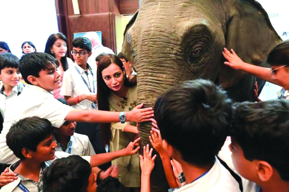 Bollywood actor Dia Mirza has helped promote the use of robotic elephants as seen here at an event with schoolchildren in Mumbai. — AFP