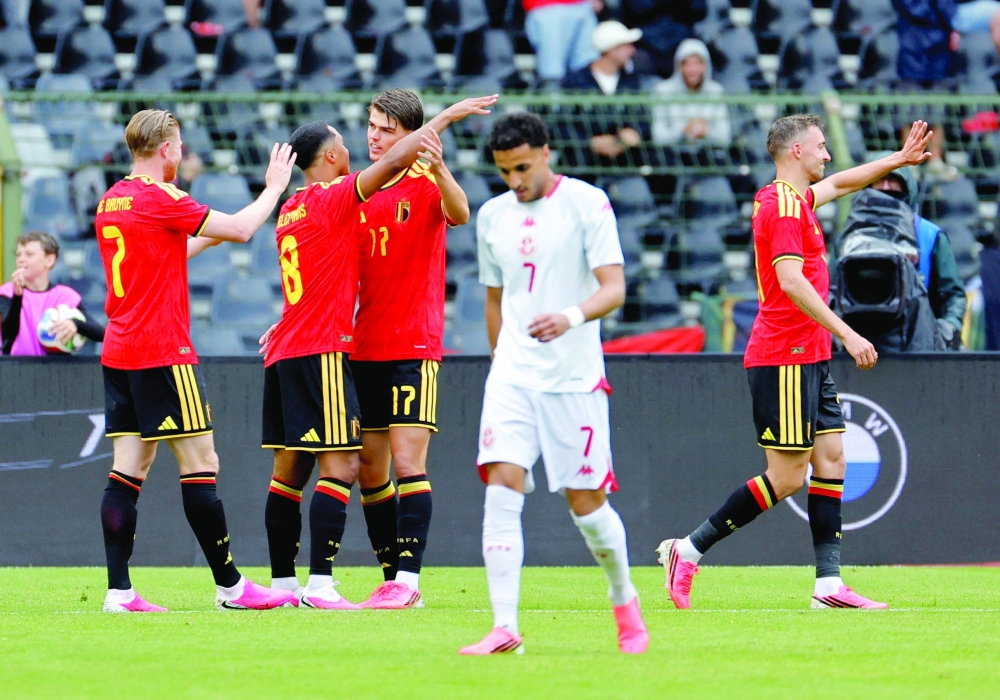 Belgium's Charles De Ketelaere celebrates scoring their second goal with team-mates