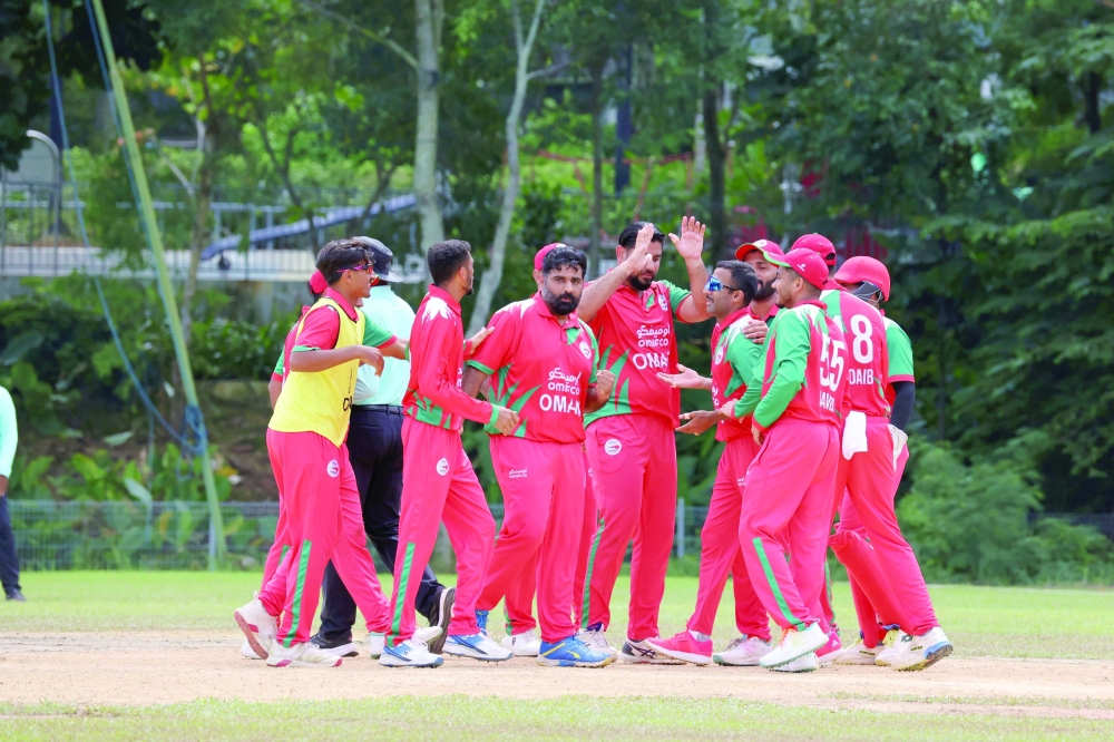 Oman celebrating wicket vs Nepal.