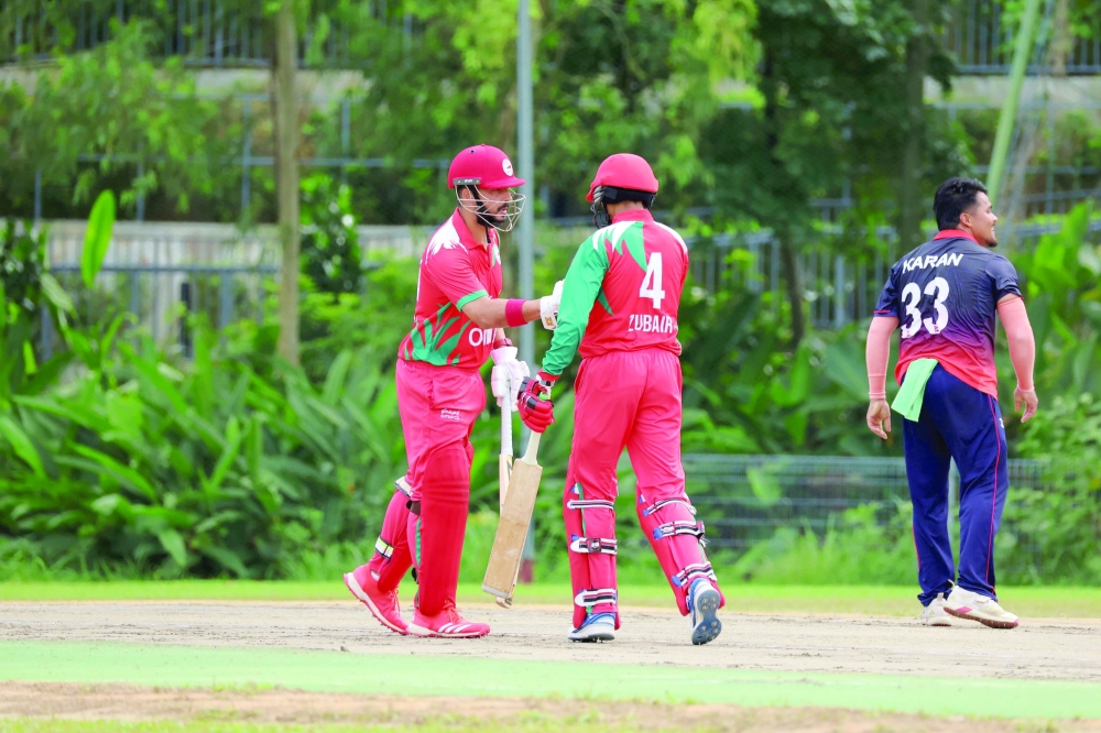 Sufyan Mahmood and Zubair al Balushi batting vs Nepal.