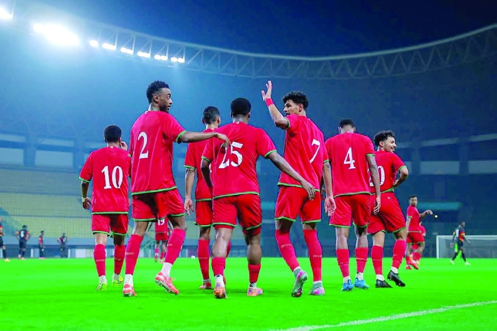 The Red Warriors celebrate a morale-boosting victory over Mozambique in Jakarta.