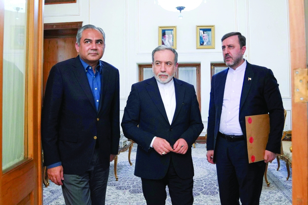 Iranian FM Abbas Araqchi and Pakistan's Interior Minister Mohsin Naqvi look on as they meet in Tehran. — Reuters 