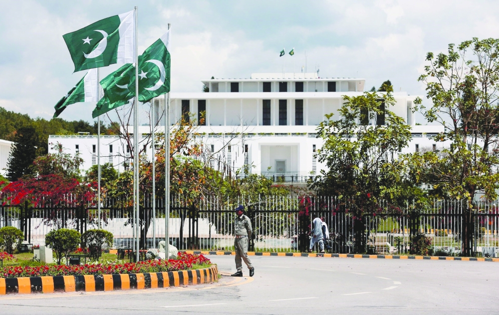 A security guard patrols outside the Aiwan e Sadr (Presidential Palace) in Islamabad, Pakistan. — Reuters file photo