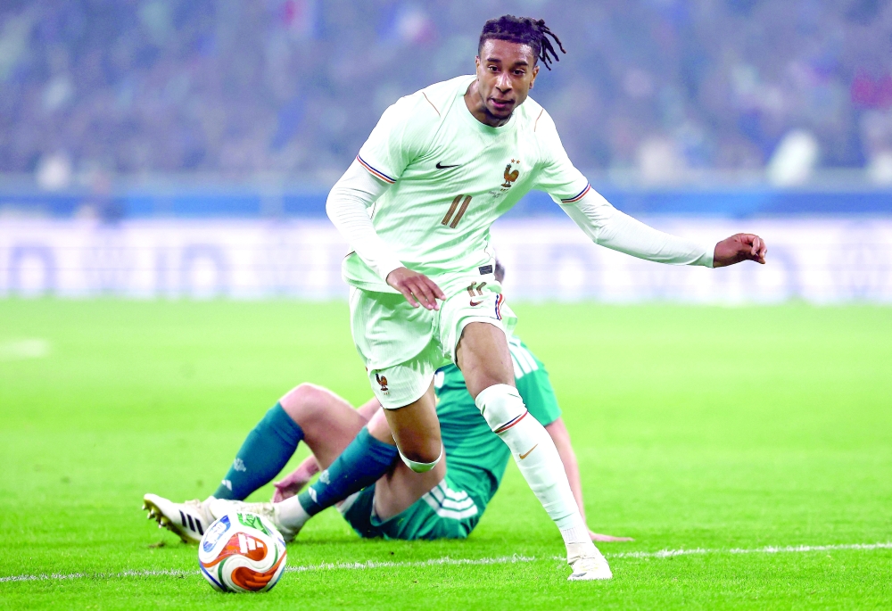 France's forward #11 Michael Olise ccontrols the ball during the international friendly football match between France and North Ireland at the Decathlon Arena - Pierre Mauroy stadium in Villeneuve-d'Ascq, northern France on June 8, 2026, ahead of the 2026 FIFA World Cup football tournament. (Photo by FRANCK FIFE / AFP)

