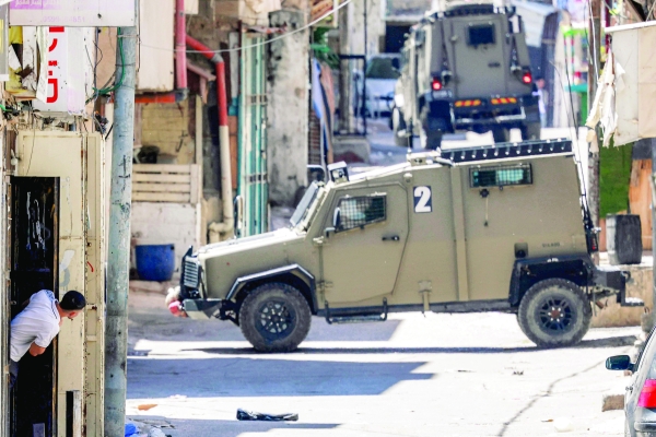 Israeli forces shield settlers during attacks on Palestinians