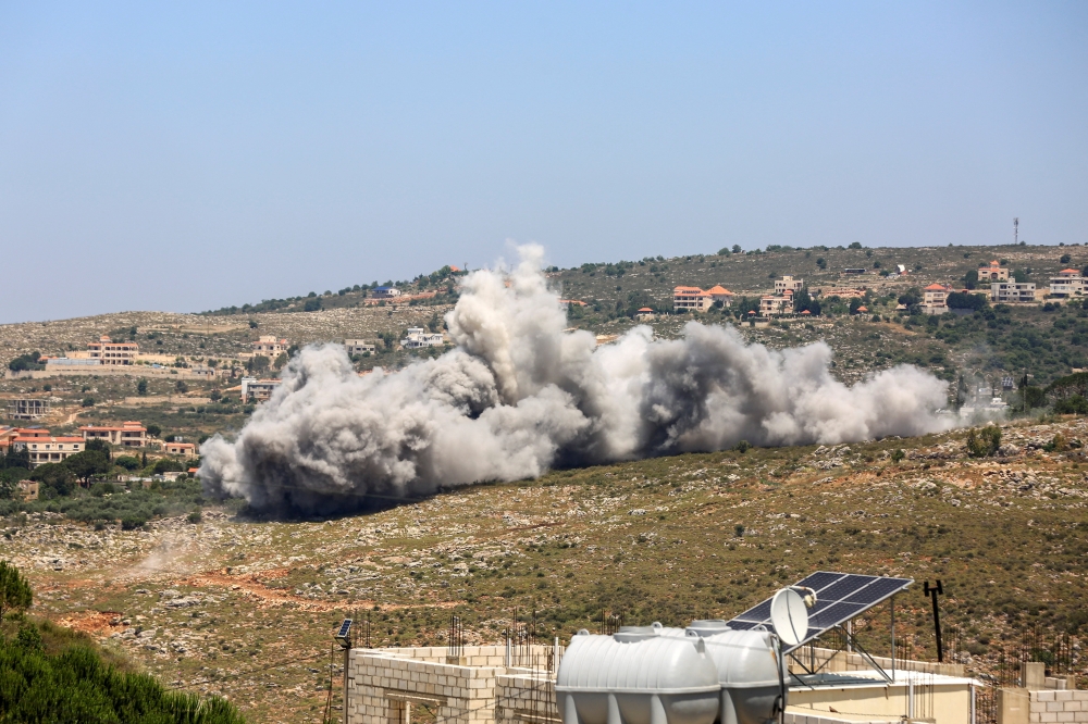 Smoke rises following an Israeli strike as seen from Houmine El Faouqa, southern Lebanon, June 10, 2026. 