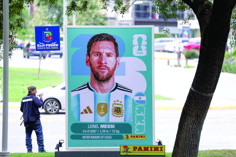 TOPSHOT - A big Panini sticker depicting Argentina's forward Lionel Messi is pictured on a street in San Pedro Garza Garcia, near Monterrey, Mexico on June 9, 2026, ahead of the 2026 World Cup football tournament. (Photo by Julio Cesar AGUILAR / AFP)

