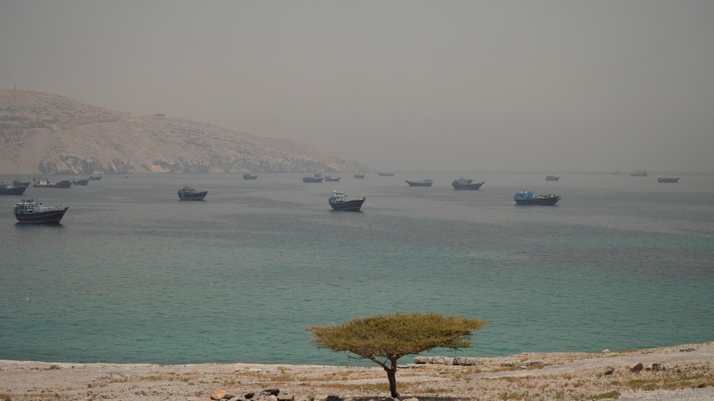 Vessels are anchored in the Strait of Hormuz, as seen from Musandam, Oman, June 11, 2026.