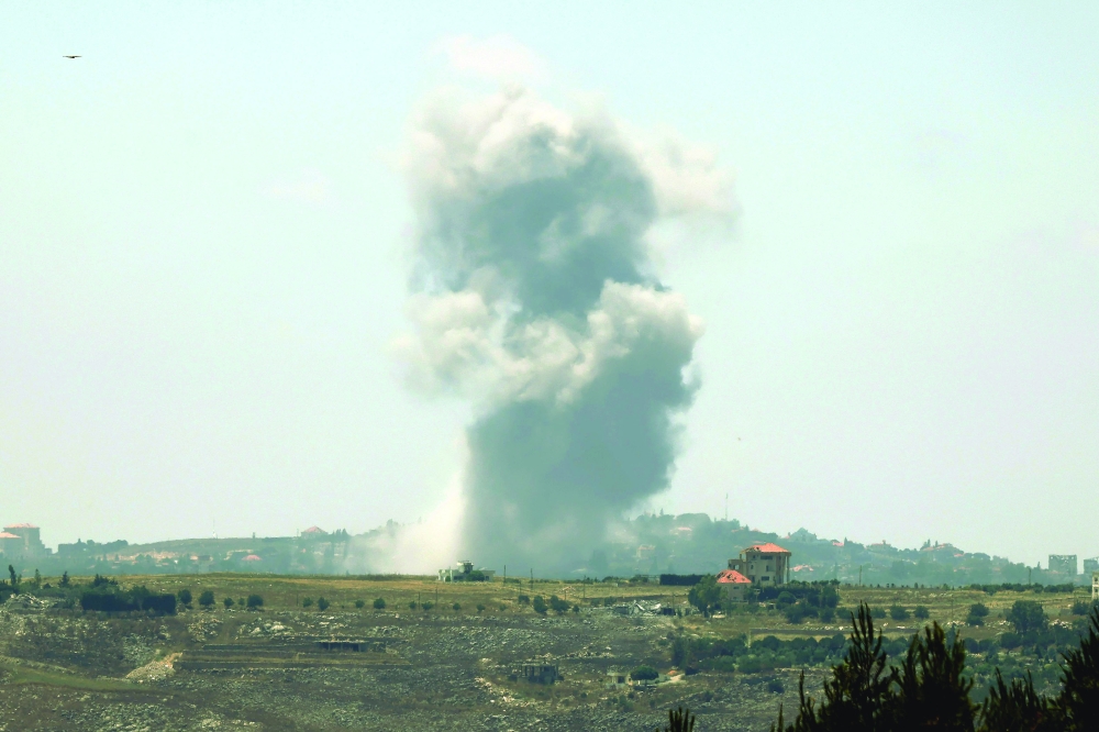 Smoke rises from the site of an Israeli air strike that targeted the village of Choukine. - AFP