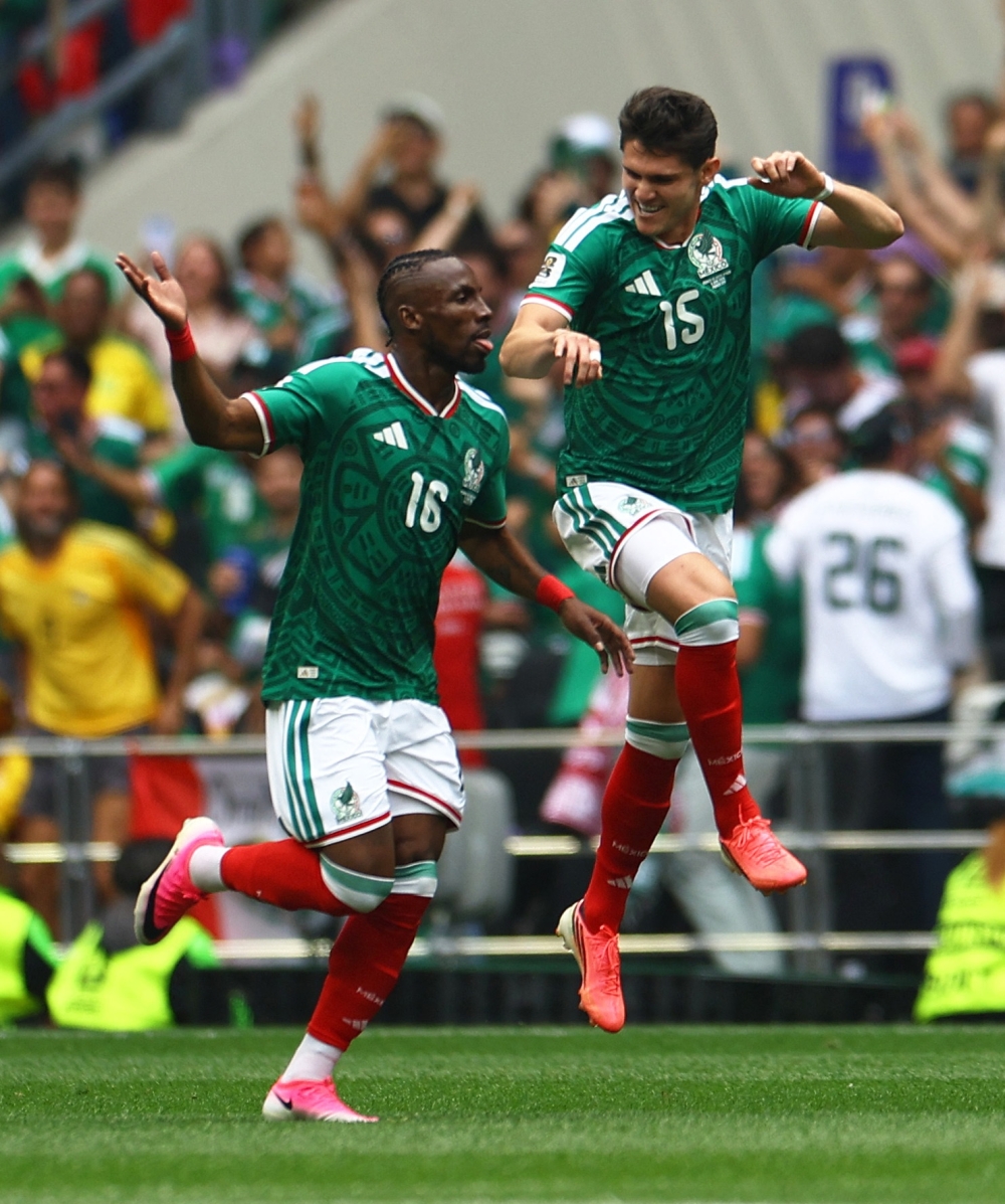 Mexico's Julian Quinones celebrates scoring their first goal with Reyes. — Reuters