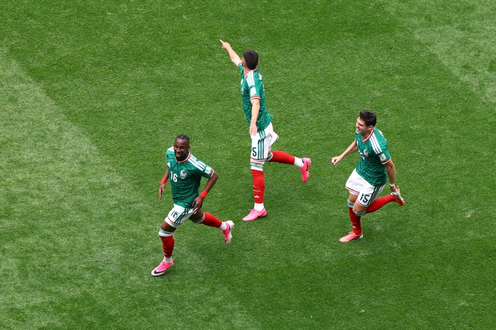 
Mexico's Julian Quinones celebrates scoring their first goal with Roberto Alvarado and Reyes.— Reuterts
