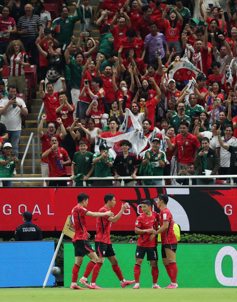  
South Korea's Oh Hyeon-gyu celebrates scoring their second goal. — Reuters