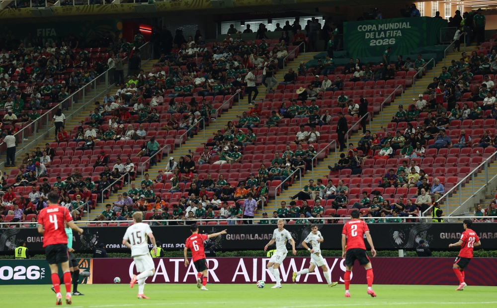  
Empty seats are seen in the stands during the match. — Reuters
