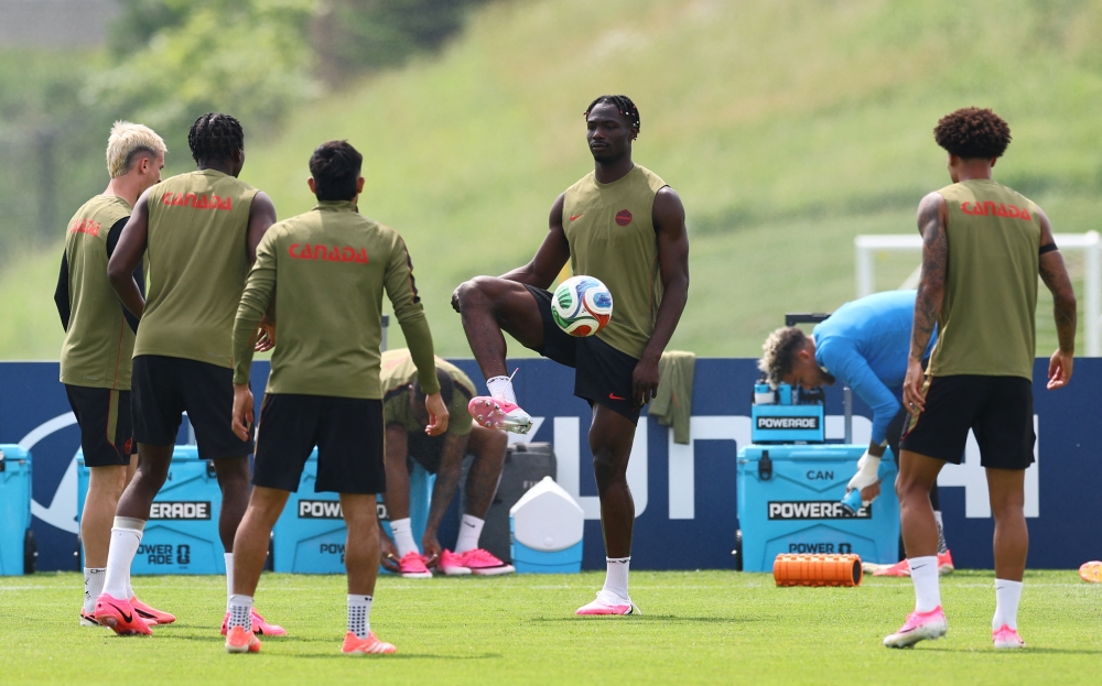  
Canada's Promise David and teammates during training. — Reuters