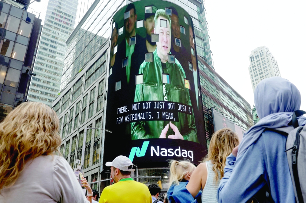 A live feed shows SpaceX CEO Elon Musk on the day of SpaceX's IPO at the Nasdaq MarketSite