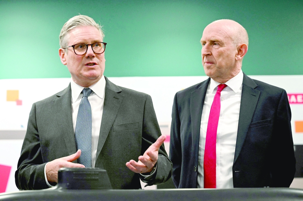 Britain's Prime Minister Keir Starmer and Britain's Defence Secretary John Healey meet with BAE system apprentices