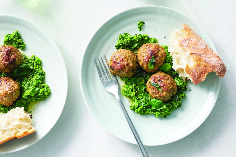Puréeing peas with basil, garlic and olive oil turns them into a verdant sauce that tastes like spring when paired with these lamb meatballs. It is just as delicious with chicken or pasta.