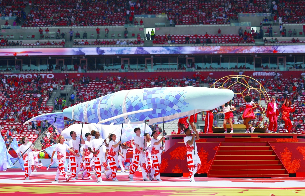 Performers during the opening ceremony before the match. — REUTERS
