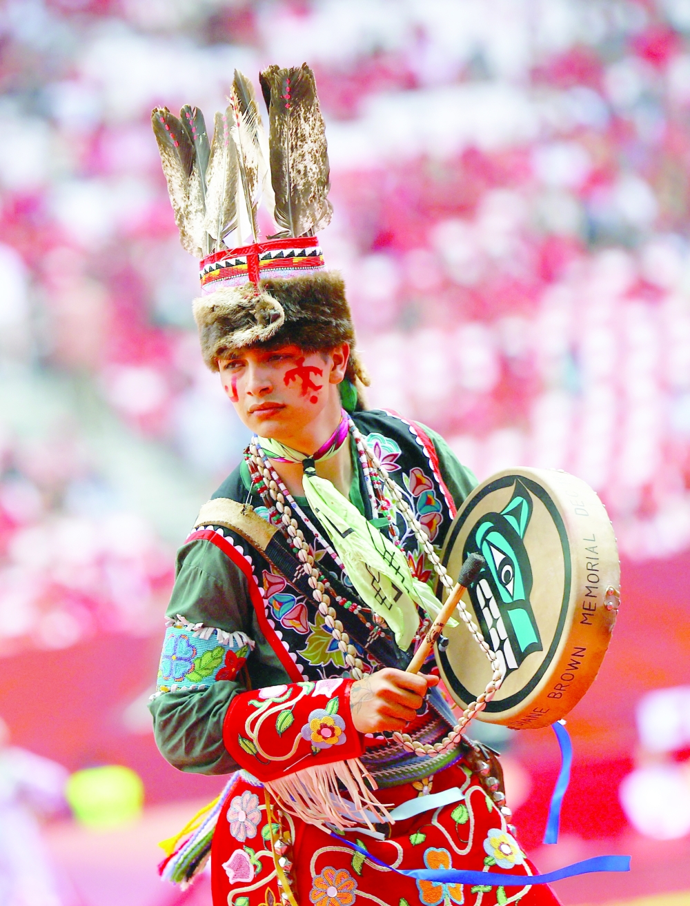 A performer during the opening ceremony before the match. — REUTERS