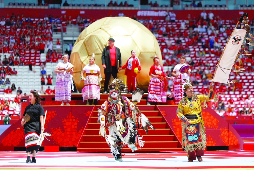 Performers during the opening ceremony before the match. — REUTERS