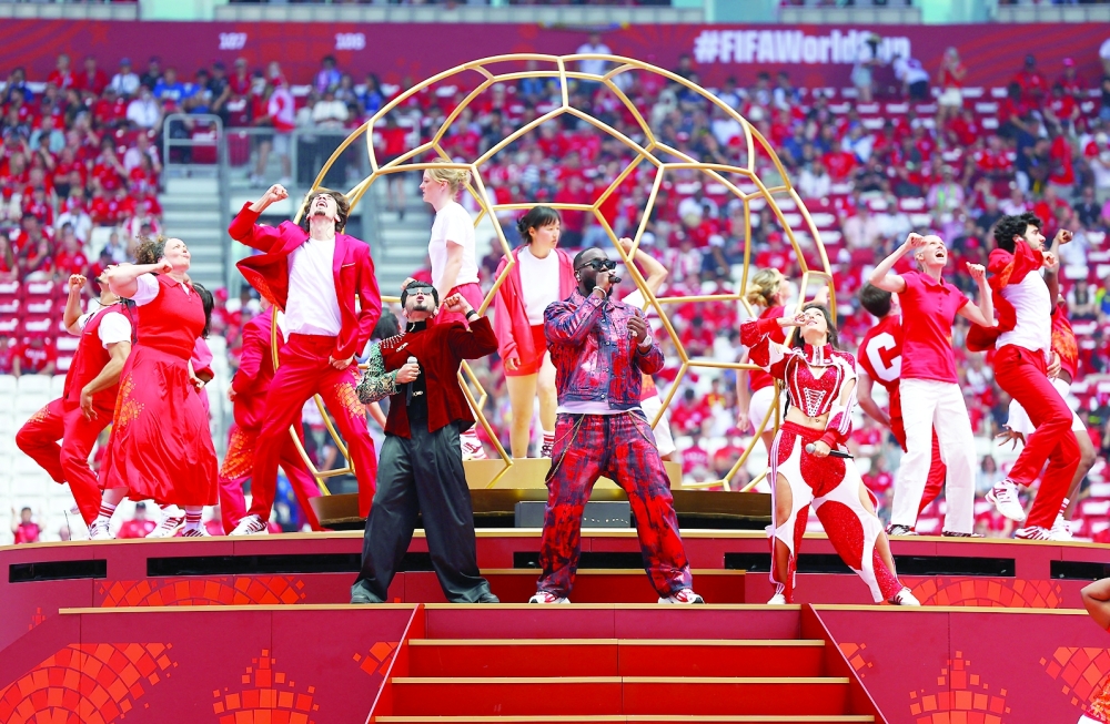 Singers Nora Fatehi, Vegedream and Sanjoy perform during the opening ceremony before the match. — REUTERS