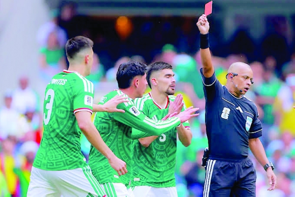 The Brazilian referee Wilton Sampaio shows the red card during the opener World Cup match between Mexico and South Africa