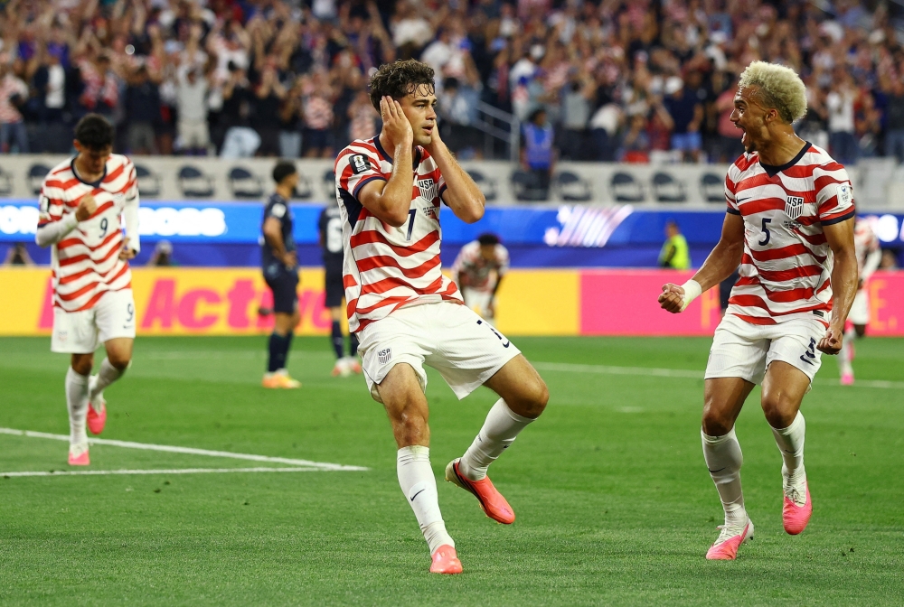 
Giovanni Reyna of the U.S. celebrates scoring their fourth goal with Antonee Robinson. — Reuters   