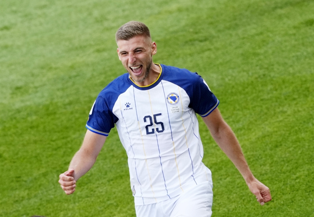 
Bosnia and Herzegovina's Jovo Lukic celebrates scoring their first goal. — Reuters