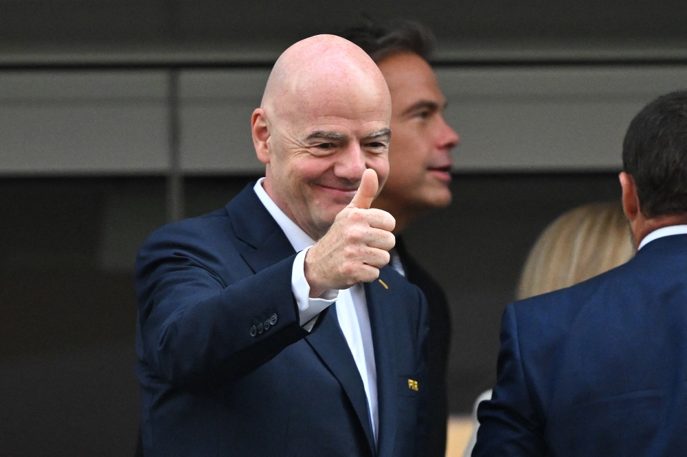 FIFA president Gianni Infantino gives a thumbs up ahead of the match between USA and Paraguay. — AFP
